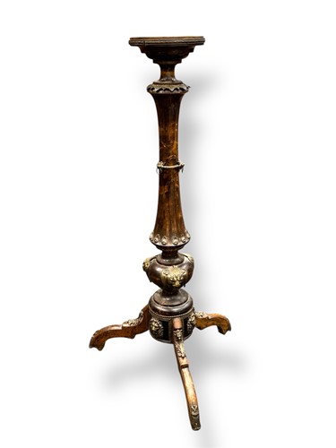Lot 625 - An Eastern hard wood torchere with gilt metal...