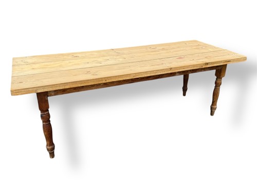 Lot 524 - A large pine refectory or dining table, turned...