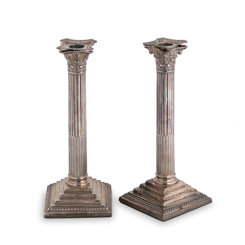 Lot 529 - A pair of George V silver candlesticks