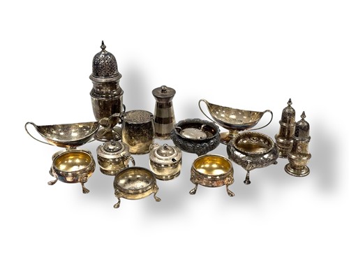 Lot 233 - A collection of silver cruets and casters,...