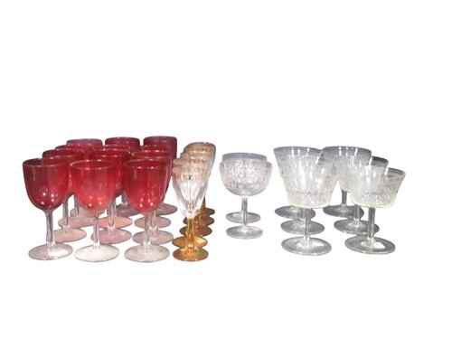 Lot 44 - A set of 12 cranberry glass wine glasses;...