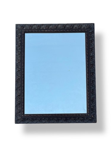 Lot 626 - A 20th century carved wood rectangular mirror...