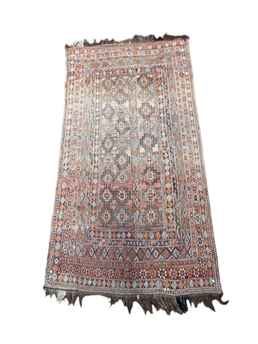 Lot 665 - A wool Afghan soumak carpet with rust coloured...