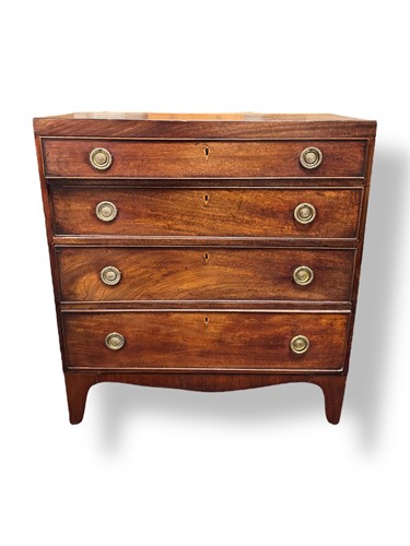 Lot 569 - A Regency mahogany chest of four long drawers,...