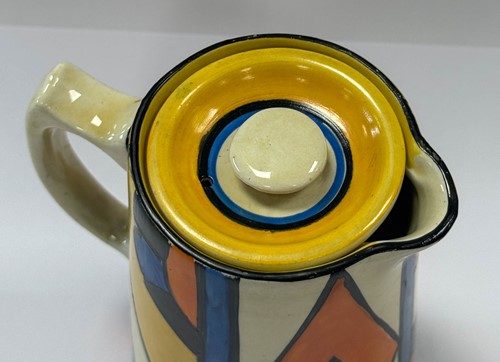 Lot 29 - A Clarice Cliff Bizarre 'Diamond' pattern hot water jug, cream jug and sugar
