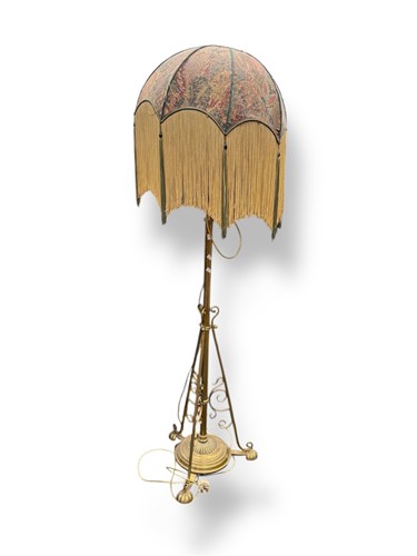 Lot 614 - A brass telescopic standard lamp with fringed...