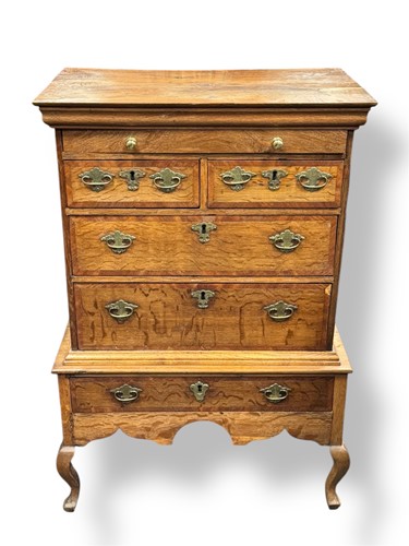 Lot 551 - A 20th century pale oak chest on stand of...
