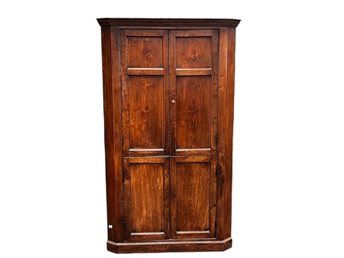 Lot 631 - A large George III style elm floorstanding...