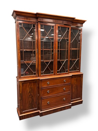 Lot 596 - A mahogany breakfront library bookcase, the...
