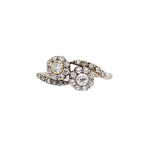 Lot 58 - A crossover style diamond set cluster ring