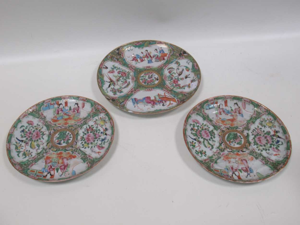 Lot 22 - A group of three Canton famille rose plates,...