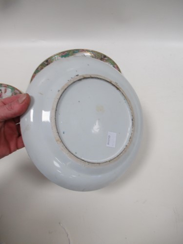 Lot 22 - A group of three Canton famille rose plates,...