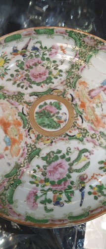 Lot 22 - A group of three Canton famille rose plates,...