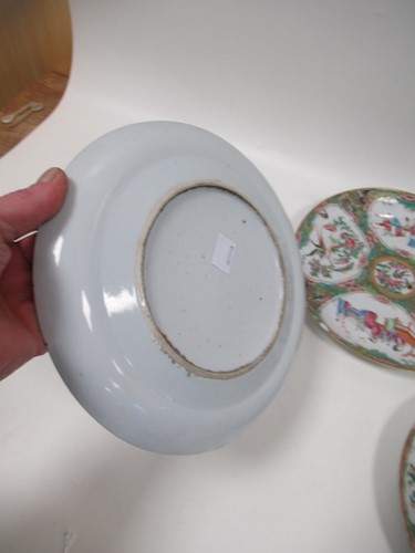 Lot 22 - A group of three Canton famille rose plates,...