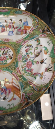 Lot 22 - A group of three Canton famille rose plates,...