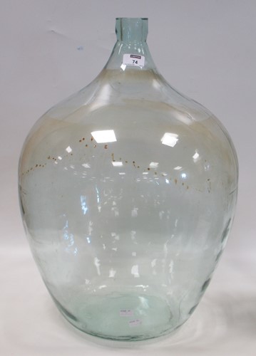 Lot 74 - A large French green glass carboy / demi...