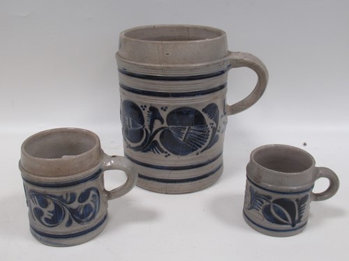 Lot 66 - Westerwald stoneware tankards with blue and...