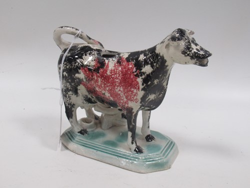 Lot 67 - A creamware cow creamer, circa 1800,  with...
