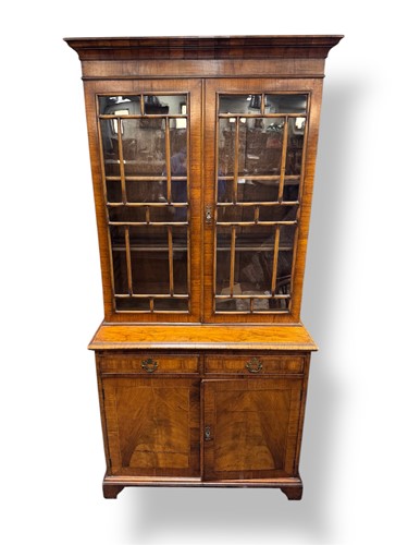 Lot 537 - A walnut bookcase by Gill & Reigate, early 20th century