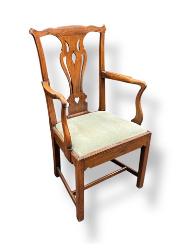 Lot 557 - A George III fruitwood elbow chair with...
