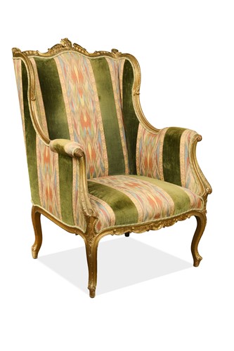 Lot 502 - A French style wing chair with giltwood frame, 19th century
