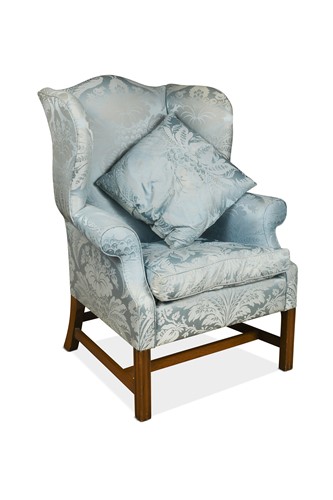 Lot 364 - A George III style mahogany wing back armchair
