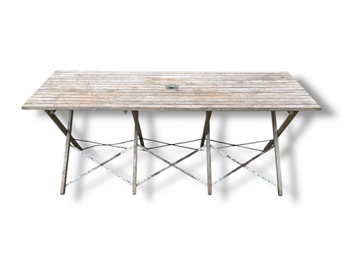 Lot 486 - A teak folding garden table, top measures 70 x...