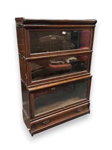 Lot 658 - A Globe Wernicke oak four section stacking...