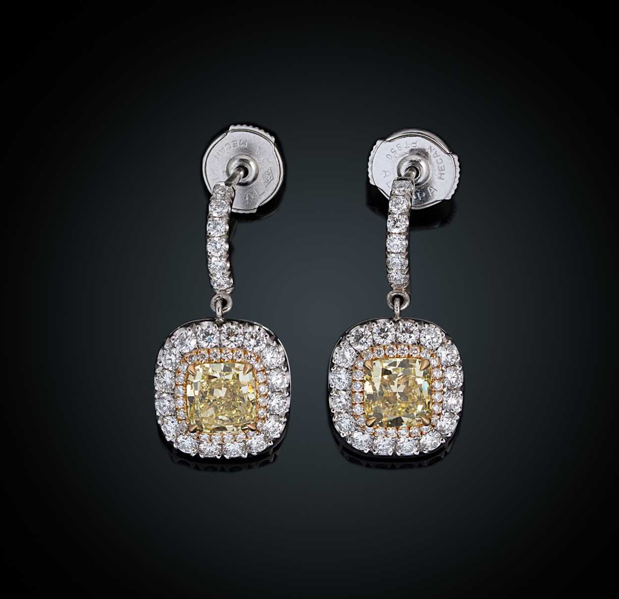 Lot 197 - A pair of yellow and white diamond ear pendants
