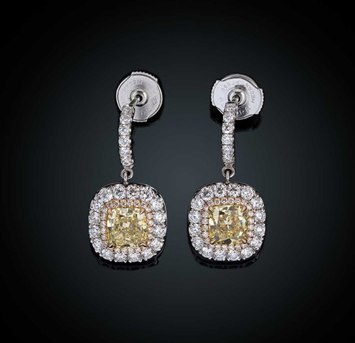 Lot 197 - A pair of yellow and white diamond ear pendants