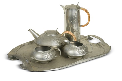 Lot 112 - Archibald Knox for Liberty & Co., a model 0231 five-piece Tudric pewter tea service