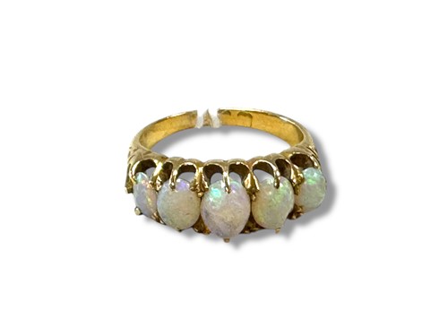 Lot 310 - An opal five stone ring, size J½, unmarked,...