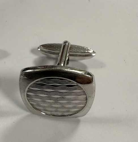 Lot 304 - Dunhill - A pair of silver collar stays and two pairs of silver cuff links