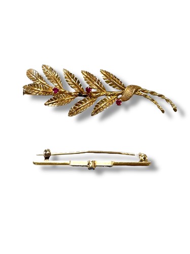 Lot 306 - Two stone set brooches, tested as 18ct gold...