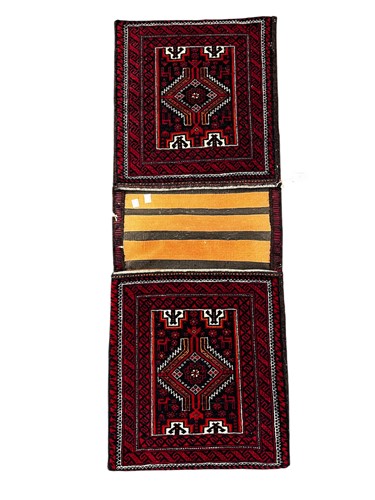 Lot 800 - A Beluchi hand knotted saddlebag in red and blue, late 20th century