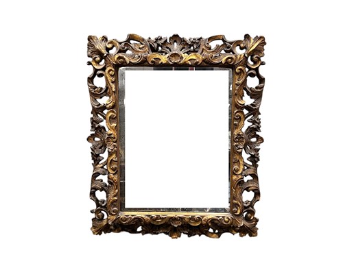 Lot 766 - A Florentine carved and gesso giltwood mirror,...