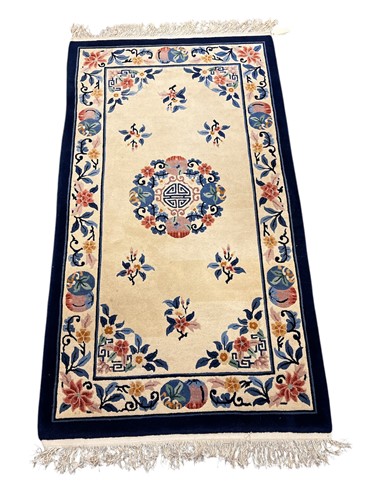 Lot 805 - A 20th century Chinese Peking wool rug, with...