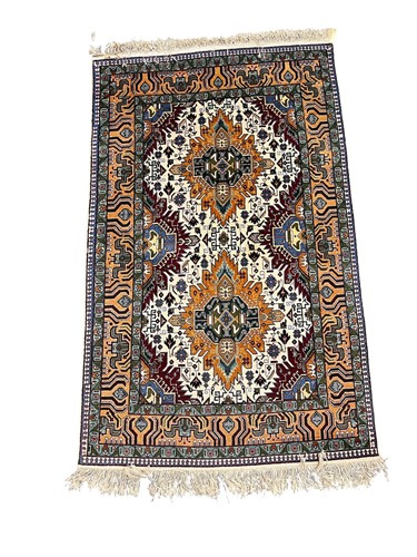 Lot 803 - A Caucasian style wool rug, 20th century