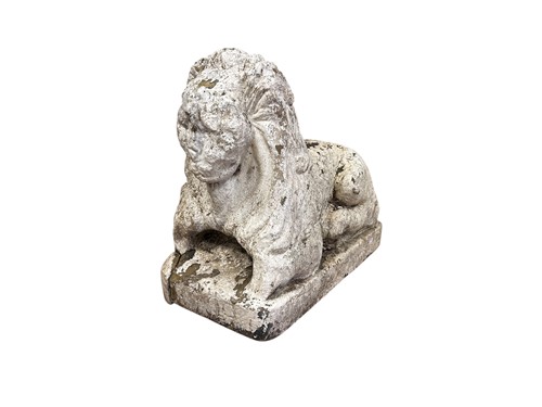 Lot 776 - A stone recumbent lion or Sphinx, possibly...