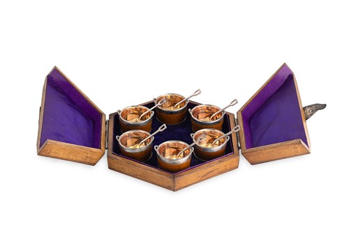 Lot 379 - A cased set of six silver plated and oak butter bowls and spoons