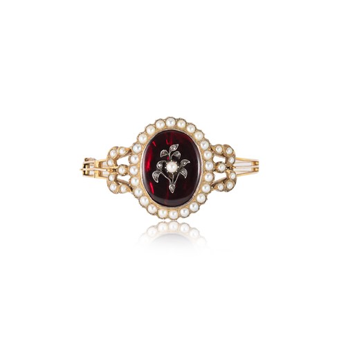 Lot 95 - A Victorian paste, split pearl and diamond hinged bangle