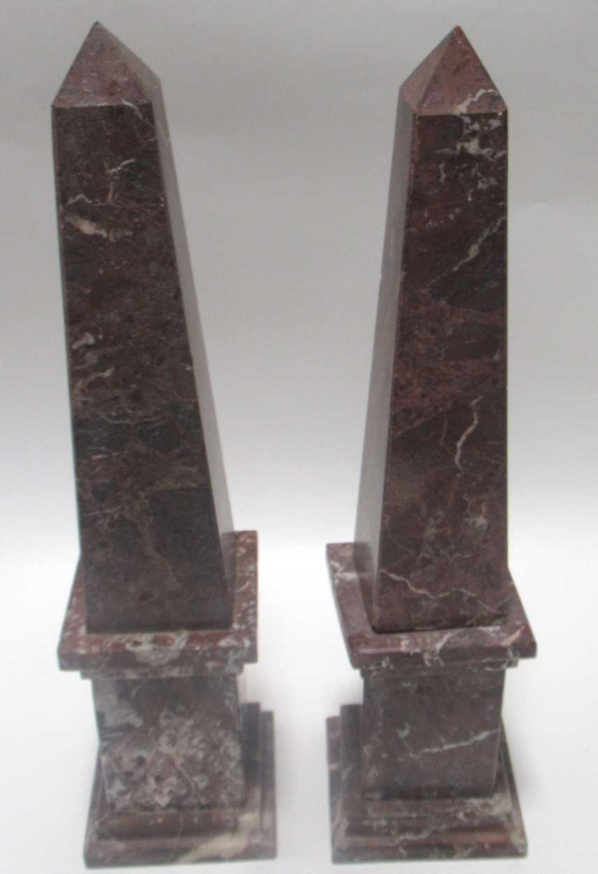 Lot 157 - A pair of variegated red and white marble...