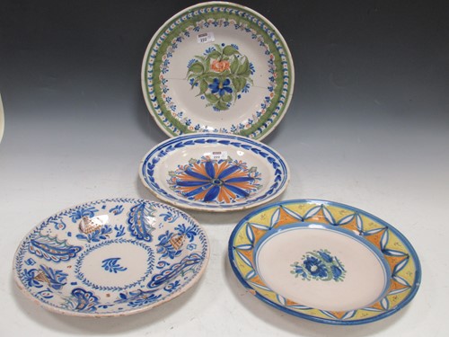 Lot 222 - Four faience chargers, largest 34cm diameter