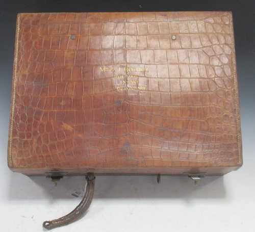 Lot 225 - A vintage crocodile leather travelling...