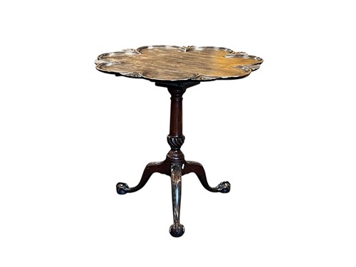 Lot 771 - A George II style tripod table with moulded...