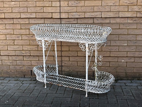 Lot 779 - A 20th century French white painted wirework...