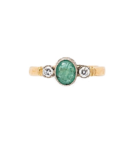 Lot 145 - An 18ct gold emerald and diamond three stone ring