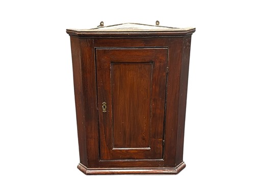Lot 624 - An oak corner cupboard, with single panelled...