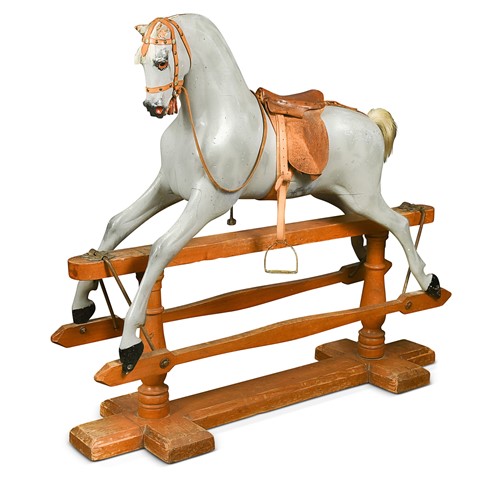 Lot 334 - A carved and grey painted wooden rocking horse, early 20th century