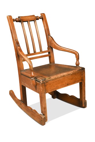 Lot 299 - A fruitwood rocking armchair, North West, 19th century